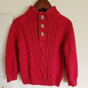 Boy's red sweater